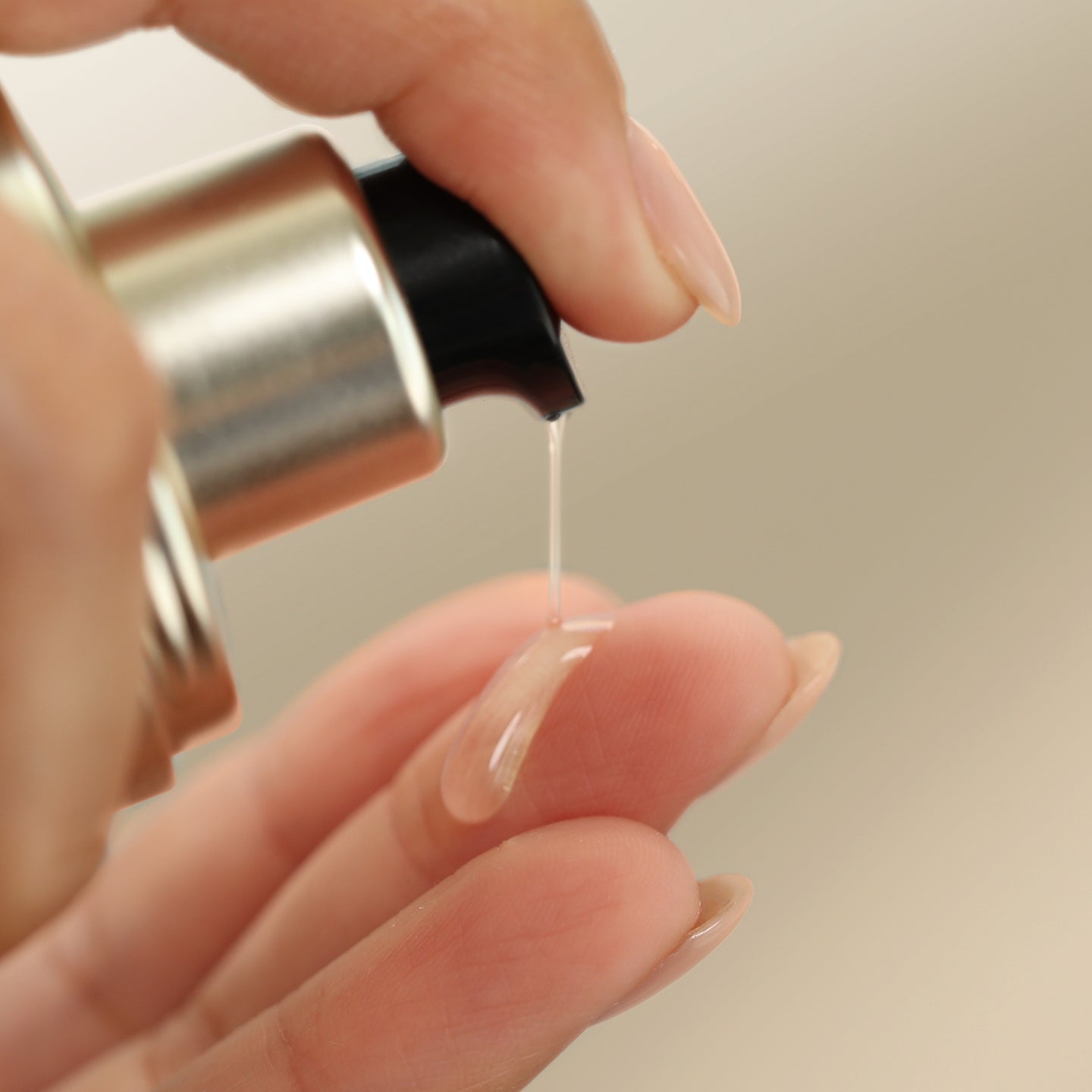 Image showing product applicator putting product on fingers