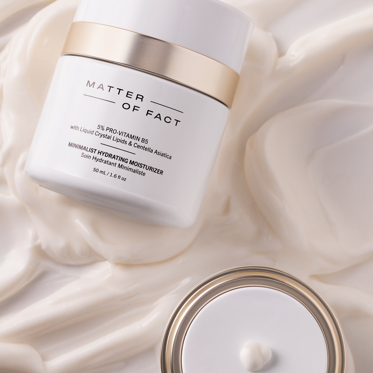 MATTER OF FACT SKINCARE MINIMALIST HYDRATING MOISTURIZER product vessel on top of product texture