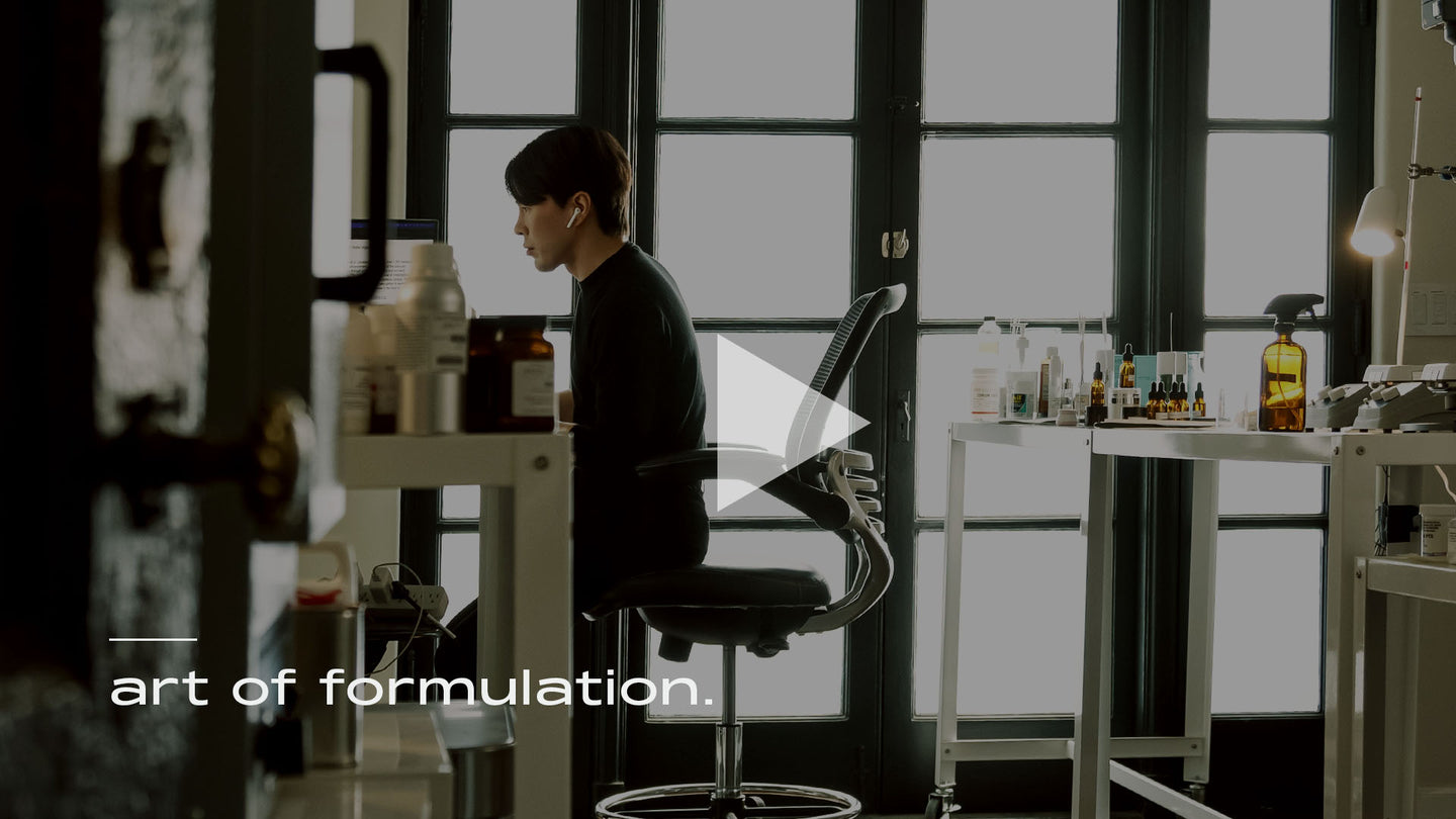 Image of MATTER OF FACT founder Paul Baek sitting on a chair in the lab