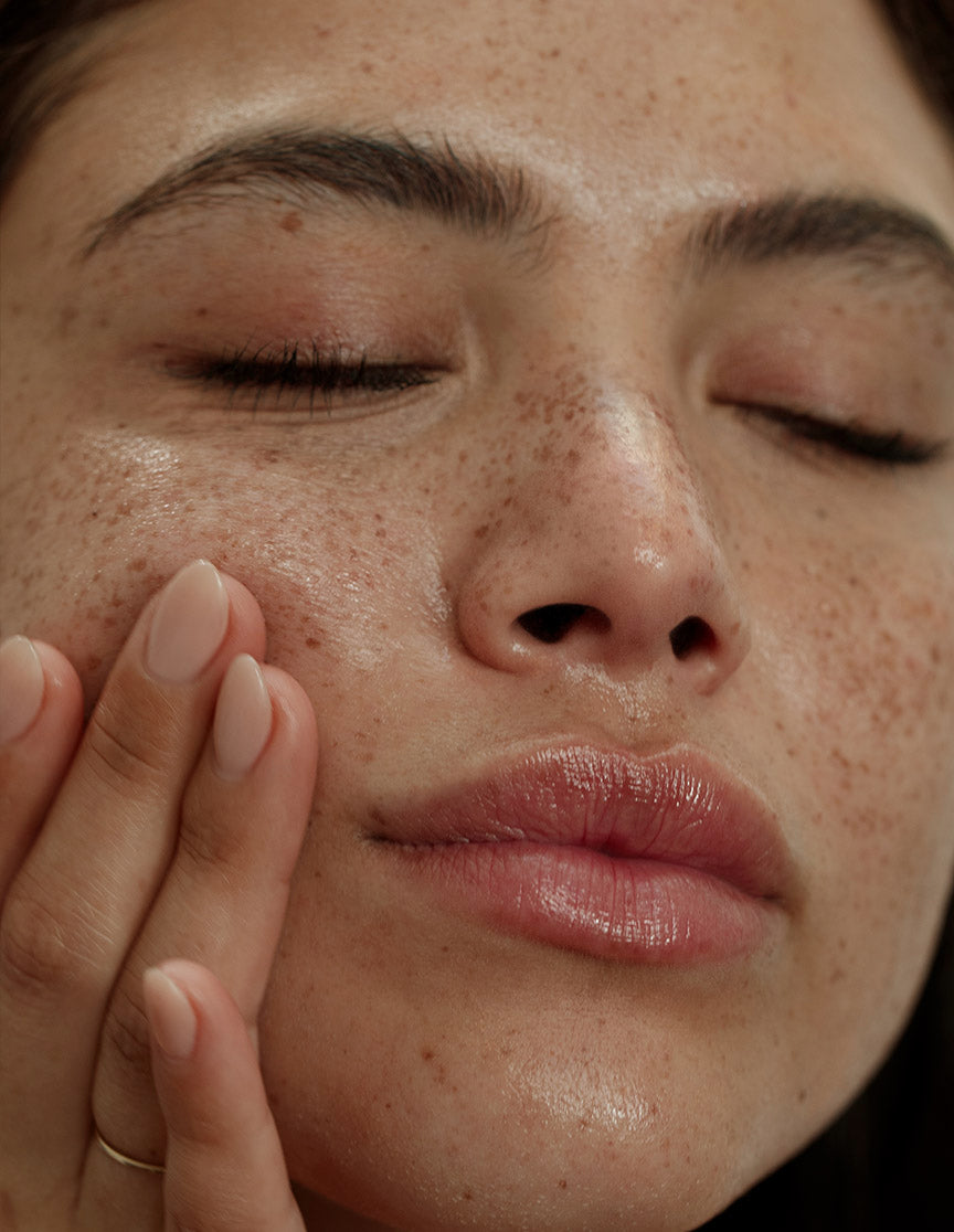 Image of womens face close up showing her hydrated skin